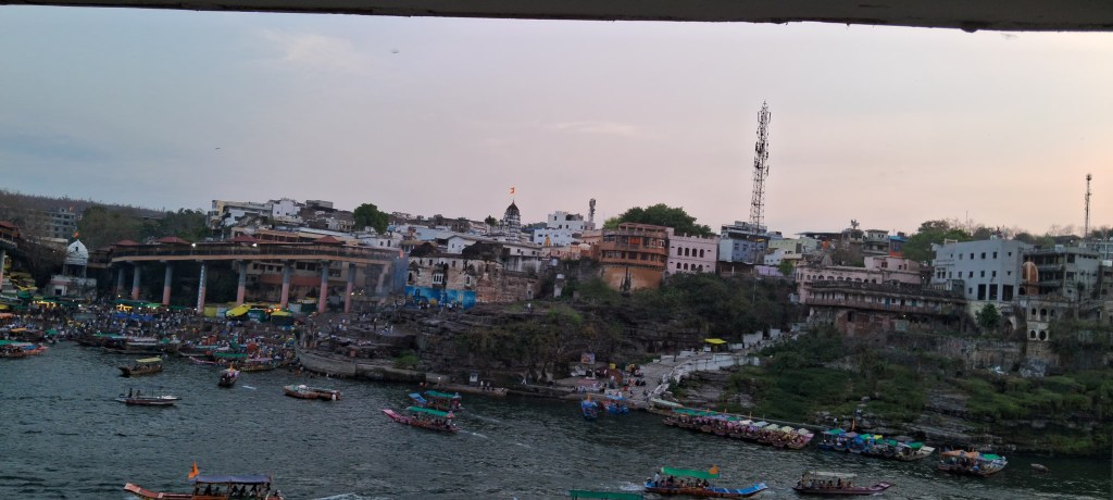 Scenic view of Omkareshwar in Madhya Pradesh with the Narmada River flowing around the temple town.